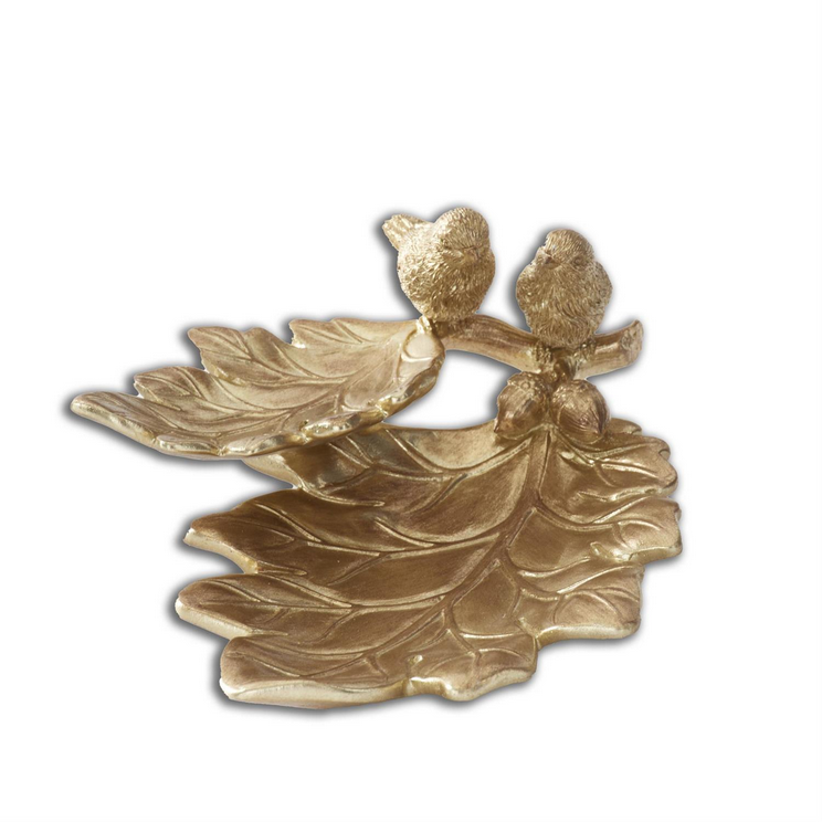 Gold decorative item with two birds on a branch on a white background