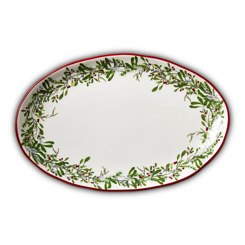 Large rectangular serving platter decorated with winter greenery and red berries.