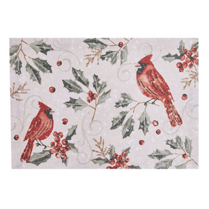 Cotton holiday placemat with a red bird cardinal design.