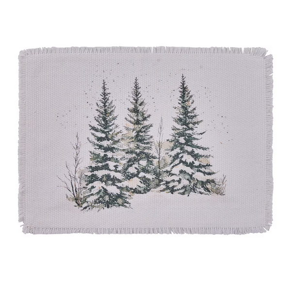 White woven cotton placemat with fringed edges and a watercolor of three snow-covered spruce trees.