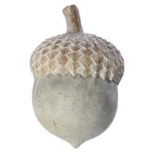 A decorative acorn sculpture with a textured, weathered gray-brown body and a lighter, patterned cap, isolated on a white background.
