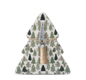 Christmas tree-shaped enameled wood serving board printed with green evergreen trees, with a stainless steel cheese knife tied on with twine.