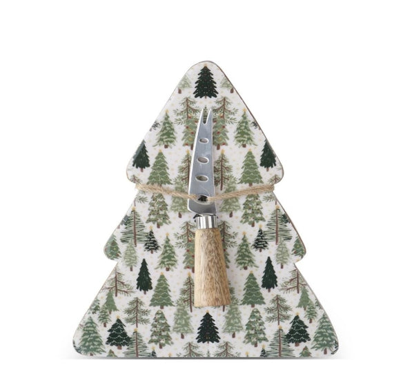Christmas tree-shaped enameled wood serving board printed with green evergreen trees, with a stainless steel cheese knife tied on with twine.