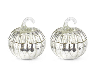 Small silver mercury glass pumpkin filled with a poured candle.