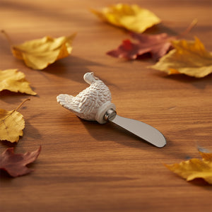 Four decorative cheese knives with autumn-themed handles, including a pumpkin, a chicken, a turkey, and a harvest scene, displayed on a white background.