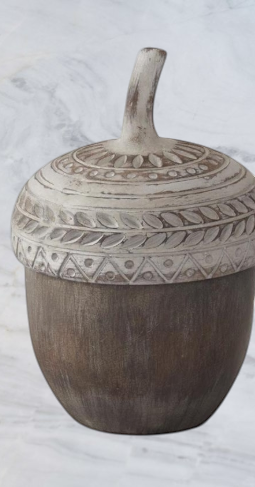 Aspen Kitchens Home+Gift resin acorn container with a decorative whitewashed lid featuring carved leaf patterns.