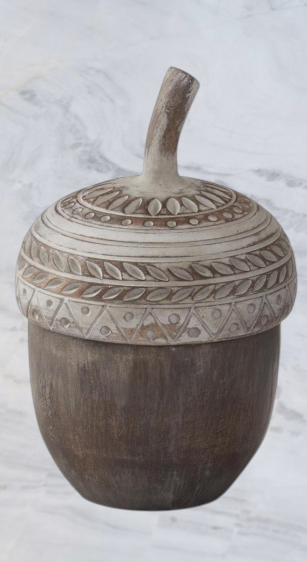 Aspen Kitchens Home+Gift resin acorn container with a decorative whitewashed lid featuring carved leaf patterns.