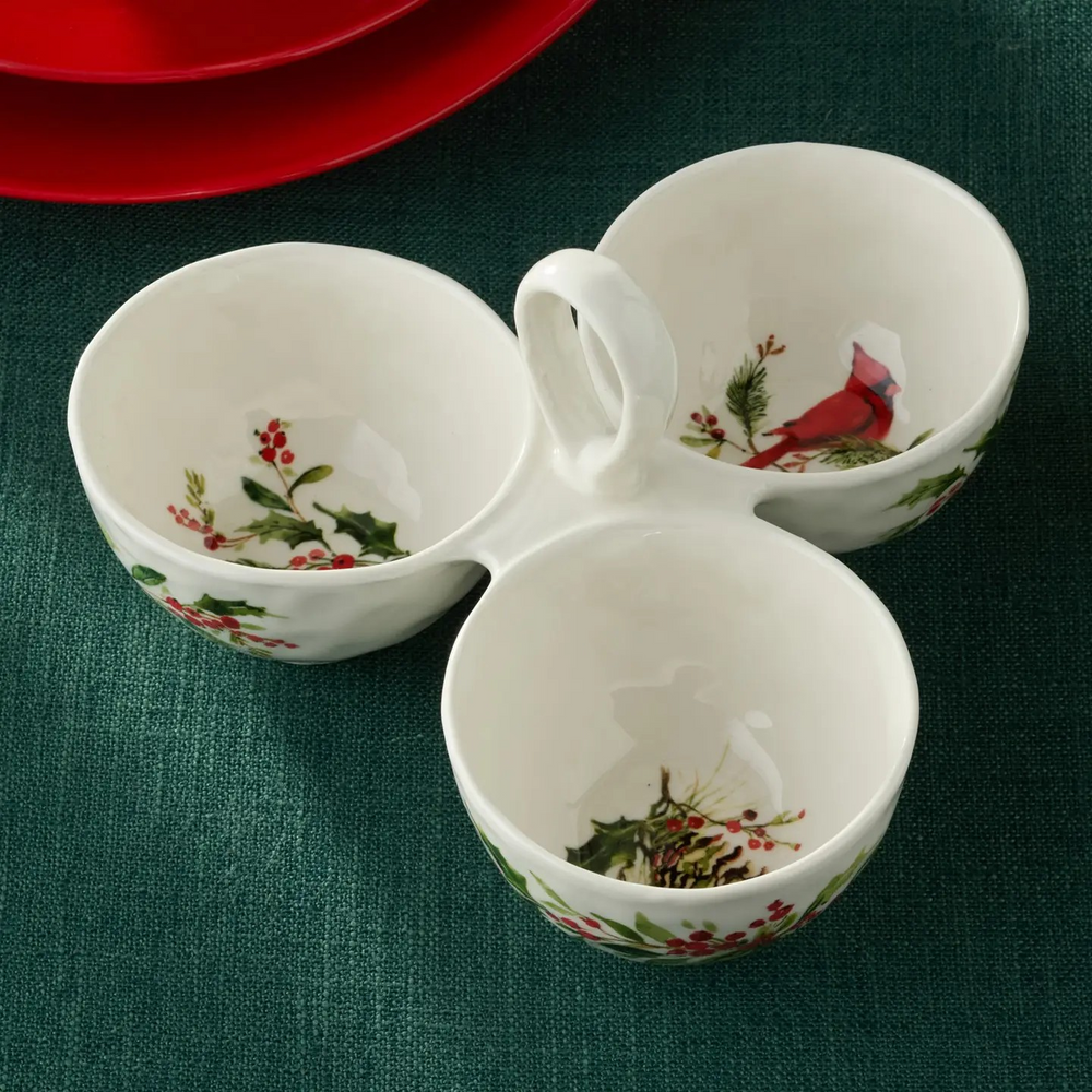 Ceramic three-section condiment server with a center handle, hand painted with holly branches, red berries & a cardinal.