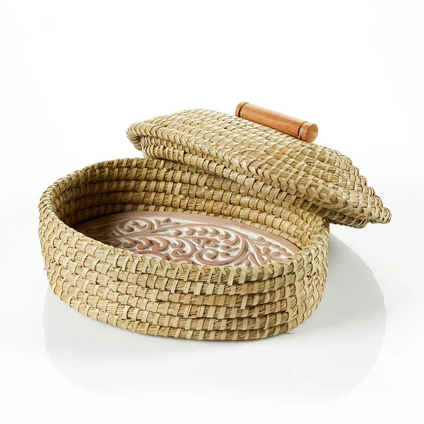 Woven basket with a lid on a white background