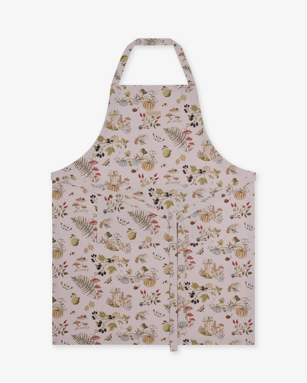 A taupe apron with an all-over autumn-themed print of pumpkins, ferns, acorns, and leaves, shown flat against a solid white background.