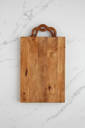 Wooden cutting board with a handle on a white background