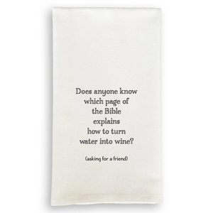 White cotton tea towel with black text reading "Does anyone know which page of the Bible explains how to turn water into wine? (asking for a friend)."