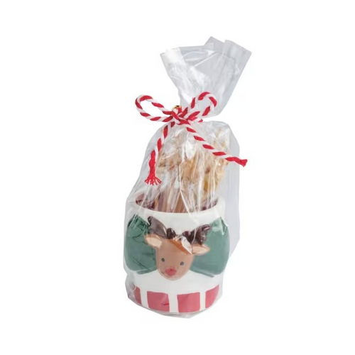 A Christmas-themed Reindeer snack toothpick holder in a clear cellophane bag tied with a red-and-white striped string. 