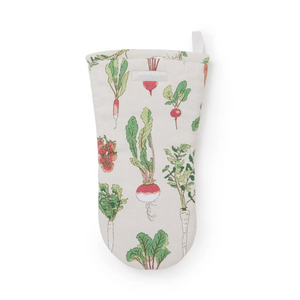 An oven mitt with a vintage-style vegetable print featuring radishes and leafy greens on a cream-colored fabric background, complete with a white hanging loop at the top.