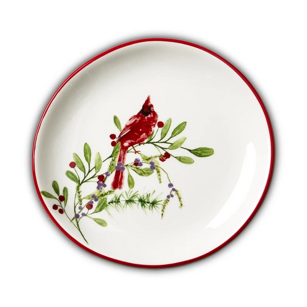 Decorative plate with a red cardinal bird and greenery on a white background