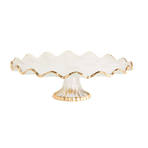 Glass cake stand with gold foil ruffle edge and pedestal.