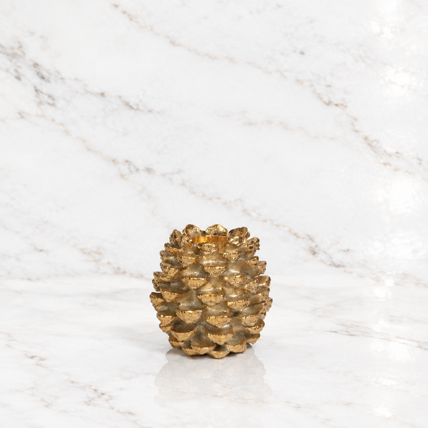 golden gilded pinecone candle holder