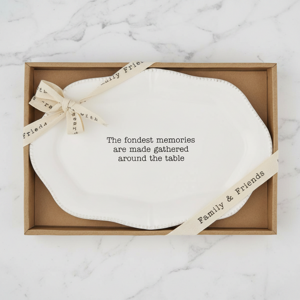 White platter that Says "The Fondest Memories are made gathered around the Table"