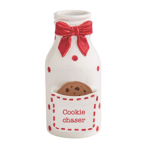 Decorative milk bottle with a red bow and cookie in a pocket labeled 'Cookie Chaser' on a white background