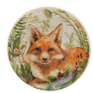 Four round ceramic coasters with animal illustrations on a white background