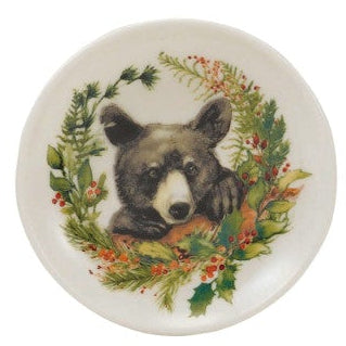 Four round ceramic coasters with animal illustrations on a white background